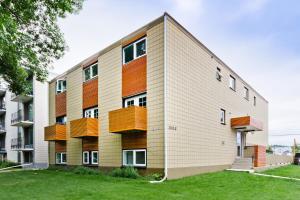 a building with balconies on the side of it at M Lofts in Calgary