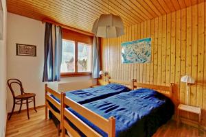 Postel nebo postele na pokoji v ubytování Bel appartement au centre de Champéry avec vue + 13 fotografií