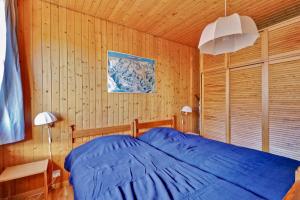 Postel nebo postele na pokoji v ubytování Bel appartement au centre de Champéry avec vue