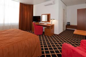 Ένα ή περισσότερα κρεβάτια σε δωμάτιο στο City Hotel Bergen op Zoom