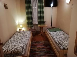 Posteľ alebo postele v izbe v ubytovaní Willa Miś