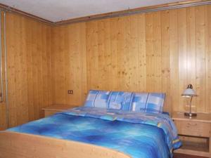 A bed or beds in a room at Holiday Creek Mortirolo