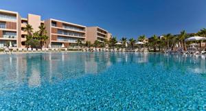 a large swimming pool in front of a resort at Apartamento Salgados Beach in Albufeira +57 photos