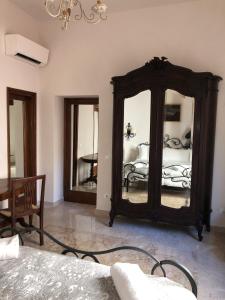 a bedroom with a large mirror and a bed at Viola Borgia in Florence
