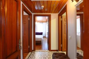 A bed or beds in a room at Elyka Hotel