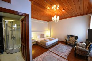 A bed or beds in a room at Elyka Hotel