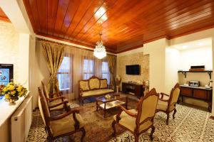 A television and/or entertainment centre at Elyka Hotel