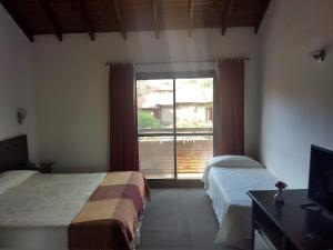 Una cama o camas en una habitación de Villa de Merlo All Inclusive & Spa by MH