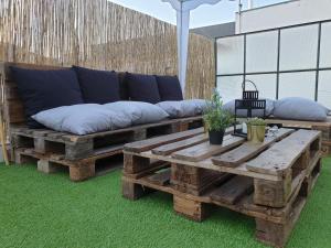 a couch sitting on top of a wooden table at Invicta Flats - Oporto in Porto