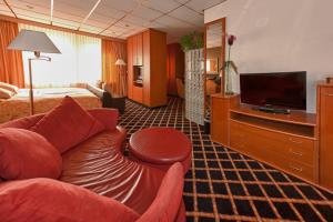 TV a/nebo společenská místnost v ubytování City Hotel Bergen op Zoom
