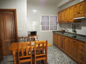 A kitchen or kitchenette at apartamentos la villa 2