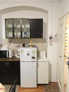 a kitchen with two white refrigerators in a room at House Centrul Istoric in Sibiu +52 photos