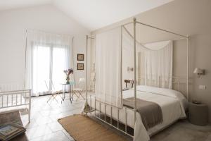 Postel nebo postele na pokoji v ubytování Masseria Fontana di Vite