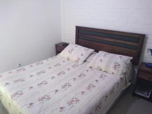 Postel nebo postele na pokoji v ubytování Hotel Angamos