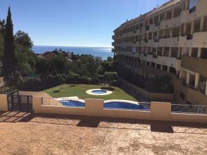 arial view of a building with a view of a garden at Fuengirola Apartment in Fuengirola