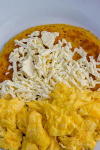 a bowl of food with cheese on top of it at Cartagena Legends in Cartagena de Indias