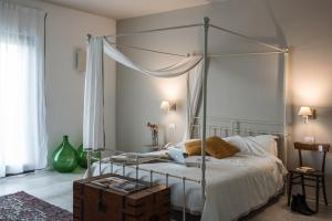 Postel nebo postele na pokoji v ubytování Masseria Fontana di Vite