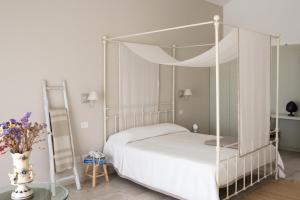 Postel nebo postele na pokoji v ubytování Masseria Fontana di Vite