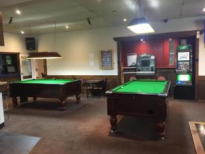 a room with two pool tables in a bar at Yarram Commecial Hotel Motel in Yarram