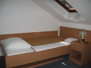 Postel nebo postele na pokoji v ubytování Hotel Veli Jože