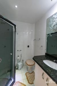 Ванная комната в Loft da Prainha Resort AA 607