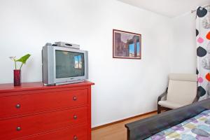 Ein Bett oder Betten in einem Zimmer der Unterkunft Apartments Alluro