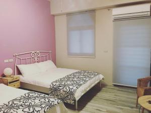 Postel nebo postele na pokoji v ubytování Lanyu IGANG Hotel