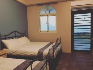 Postel nebo postele na pokoji v ubytování Lanyu IGANG Hotel