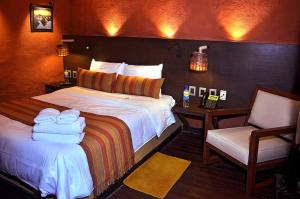 Una cama o camas en una habitación de Hotel Jardines de Uyuni