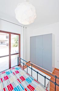 Ein Bett oder Betten in einem Zimmer der Unterkunft Apartments Alluro