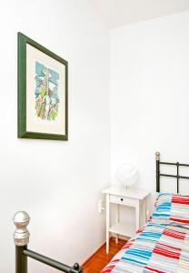 Ein Bett oder Betten in einem Zimmer der Unterkunft Apartments Alluro