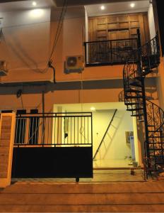 a view of a staircase in a building with a stair case at The LaWang Yogya Guesthouse in Yogyakarta