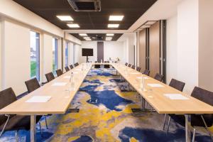 a long conference room with long tables and chairs at Best Western Plus Hotel & Restaurant Les Humanistes Colmar Nord in Sélestat +105 photos