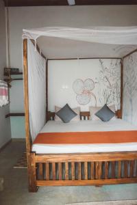A bed or beds in a room at Mellow Hostel Sri Lanka