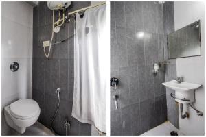 a bathroom with a toilet and a shower with a sink at Hotel The Space in Udaipur +38 photos