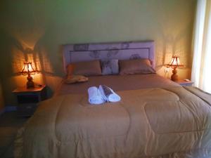 Postel nebo postele na pokoji v ubytování Three V Homestay