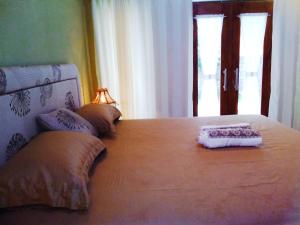 Postel nebo postele na pokoji v ubytování Three V Homestay