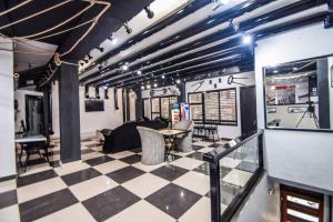 a room with a checkered floor at Hotel The Space in Udaipur