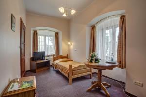 Posteľ alebo postele v izbe v ubytovaní Hotel Książ