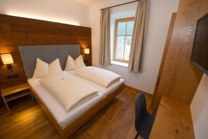 Postel nebo postele na pokoji v ubytování Hotel Brunnwirt