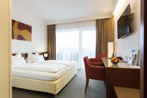 Кровать или кровати в номере Hotel & Restaurant Christkindlwirt
