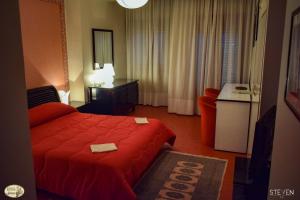 Postel nebo postele na pokoji v ubytování Hotel Ristorante Mommo