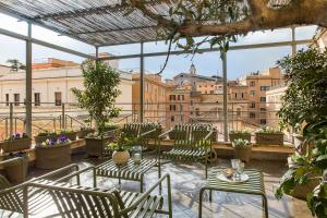A balcony or terrace at Condominio Monti Boutique Hotel