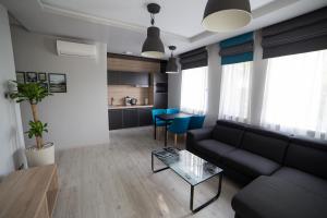 a living room with a couch and a table at Villa Mango 2 in Balatongyörök