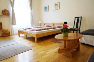 a living room with a couch and a table at Smile-Inn Budapest in Budapest