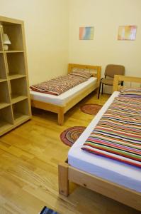 Posteľ alebo postele v izbe v ubytovaní Smile-Inn Budapest