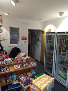a store filled with lots of different types of food at Canolfan Y Fron in Caernarfon