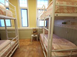 Postel nebo postele na pokoji v ubytování 橙舍一館 TW Hostel I