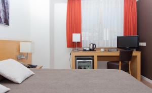 Postel nebo postele na pokoji v ubytování Hotel Sagrada Familia