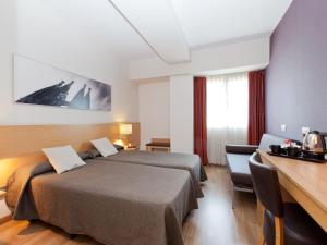 Postel nebo postele na pokoji v ubytování Hotel Sagrada Familia
